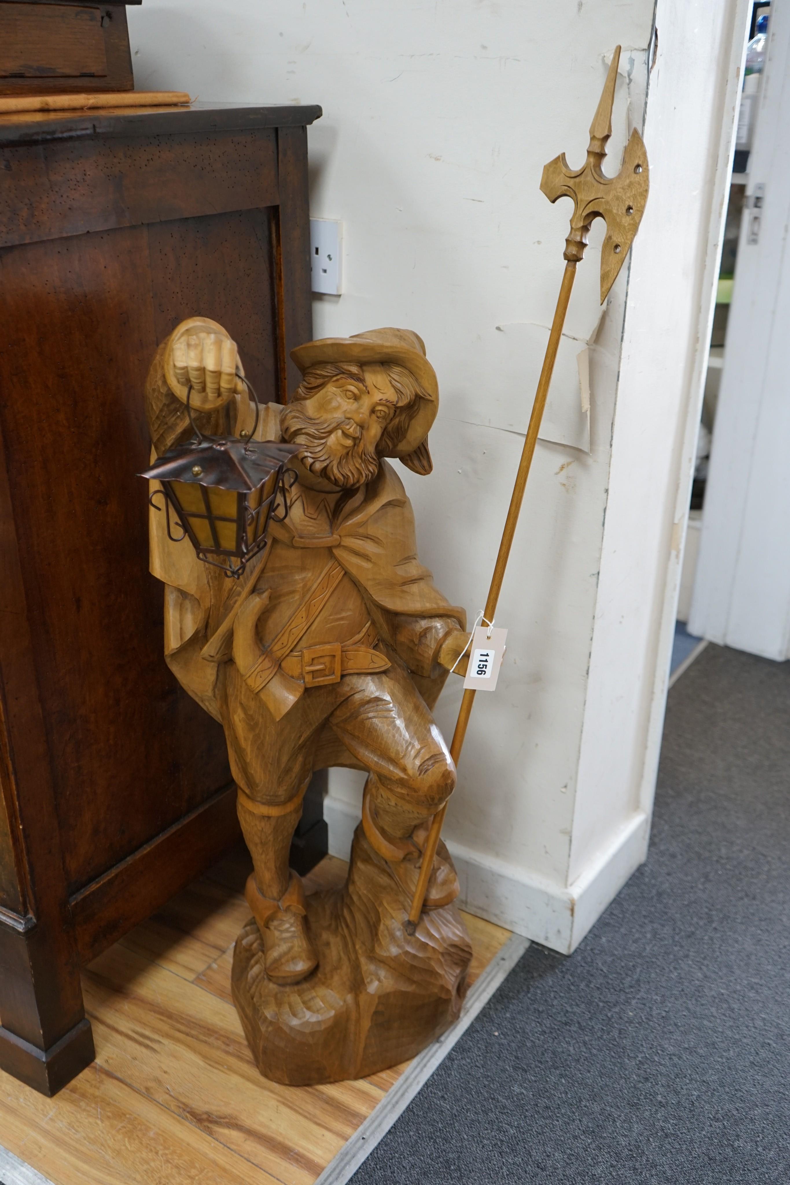 A carved wood figure of a gate keeper, height 110cm